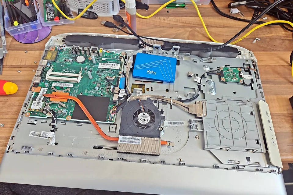 All-in-one business computer opened for internal diagnosis in Birmingham