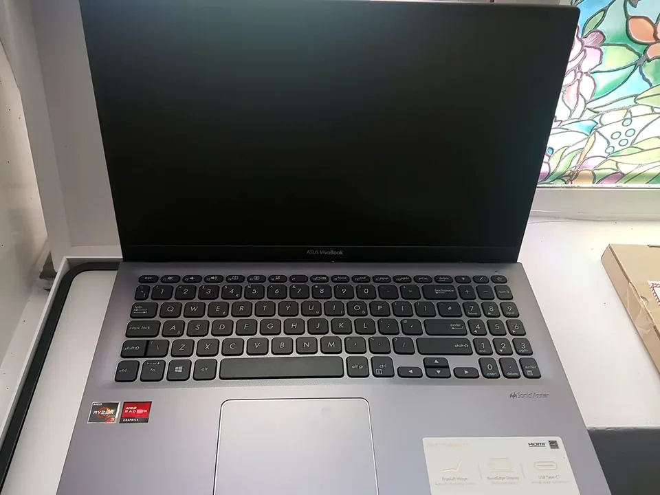 Laptop display being checked for flickering lines and dim-screen faults at PC Repair Guru Birmingham
